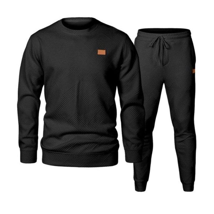 Men's active two-piece tracksuit with a comfortable sweatshirt and drawstring waist joggers for sport & leisure.