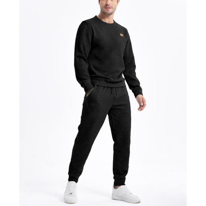 Stylish men's two-piece tracksuit, perfect for casual wear or comfortable loungewear, featuring a top and joggers.