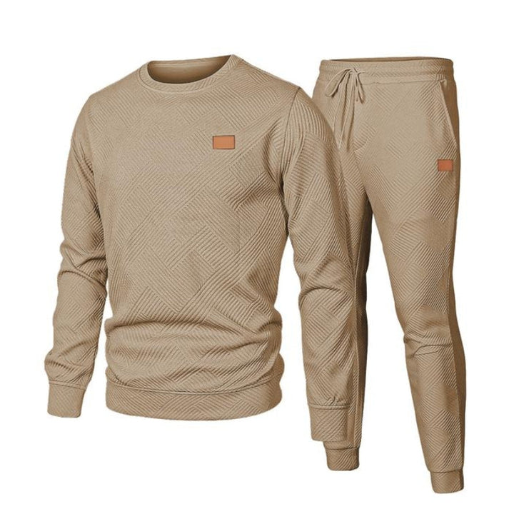 Fashionable men's two-piece tracksuit, featuring a comfy top and drawstring waist joggers for modern men's style.
