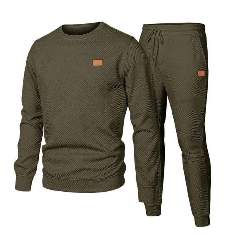 Soft men's two-piece tracksuit with a relaxed fit sweatshirt and drawstring joggers for ultimate comfort.