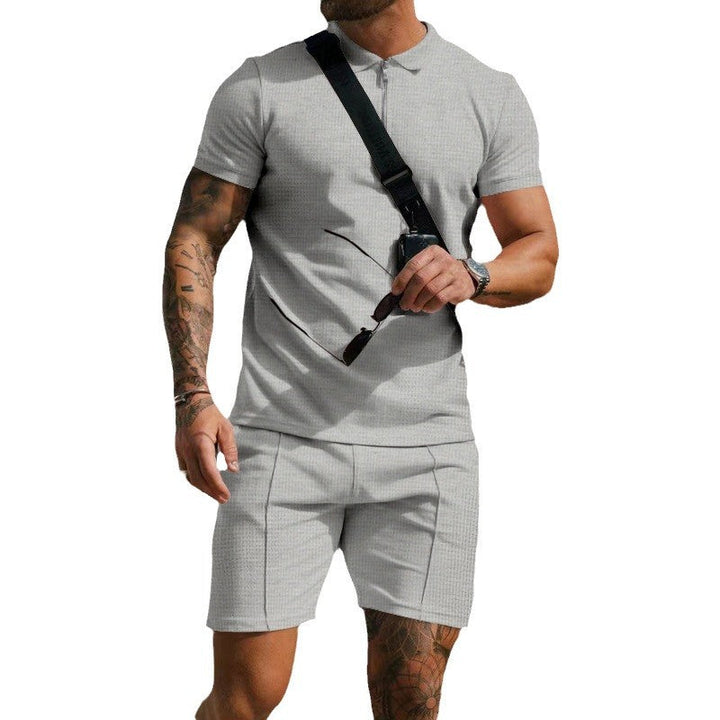 Versatile men's athletic outfit, short sleeve top and shorts, suitable for training or casual activewear.