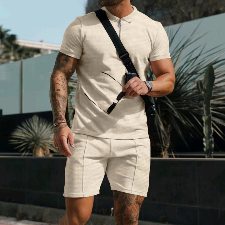 Modern men's activewear set with short sleeves & contrasting accents, ideal for gym & daily use.