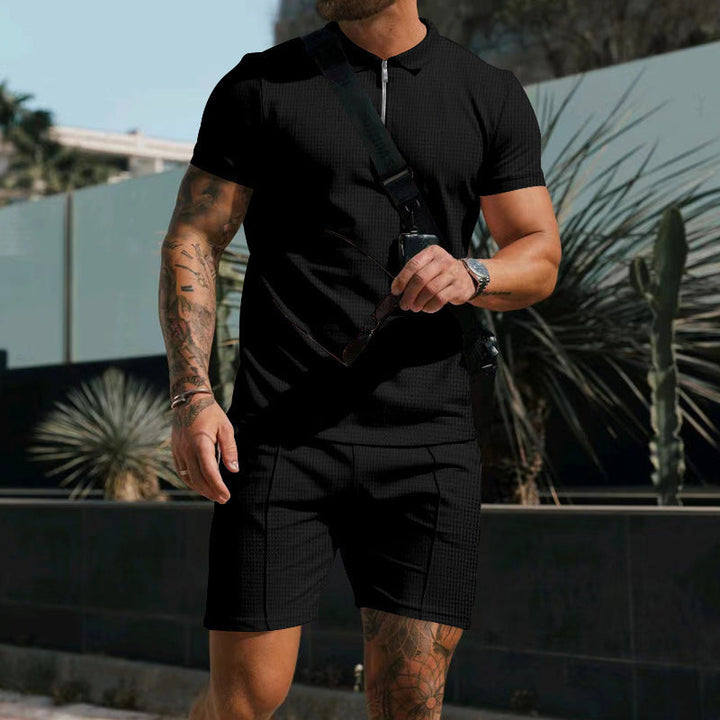 Men's workout gear: two-piece short sleeve athletic set with modern contrasting accents.