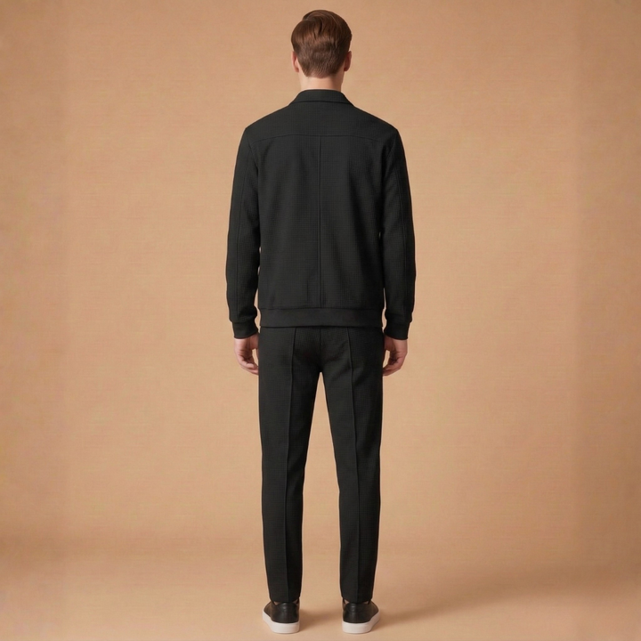 Modern men's athletic tracksuit set, combining a sleek zip jacket with straight pants for active and casual style.