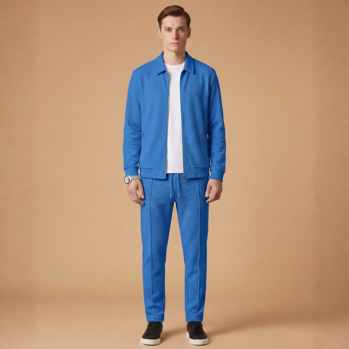 Performance men's athletic tracksuit featuring a functional zip jacket and comfortable straight pants design.