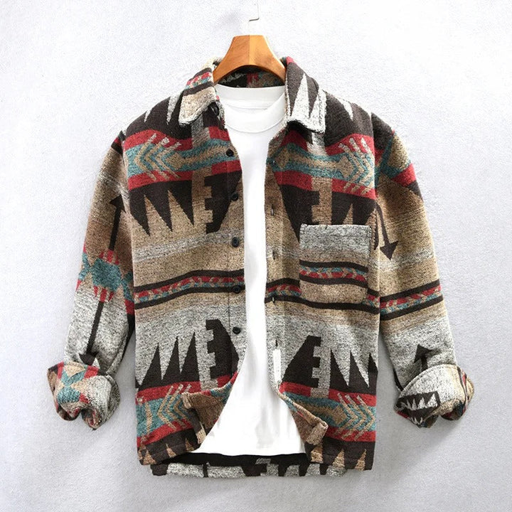Men's Aztec print button-down long sleeve shacket. Casual, stylish outerwear perfect for layering. Brown/beige hues.