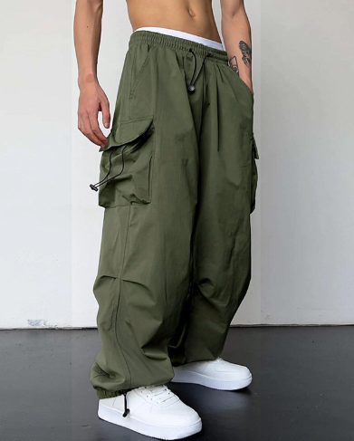 Multi-pocket utility men's baggy cargo pants with a wide leg, perfect for practical comfort and modern casual style.