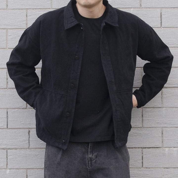 Men's black button-down casual jacket with a relaxed fit, ideal for everyday wear.