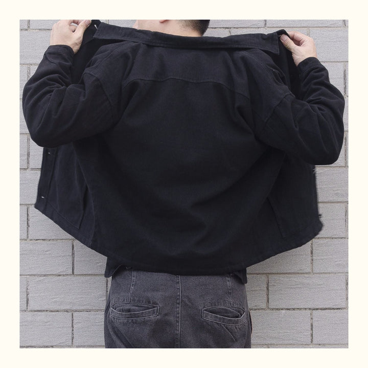 Black men's button-down casual jacket, relaxed fit for everyday comfort and style.