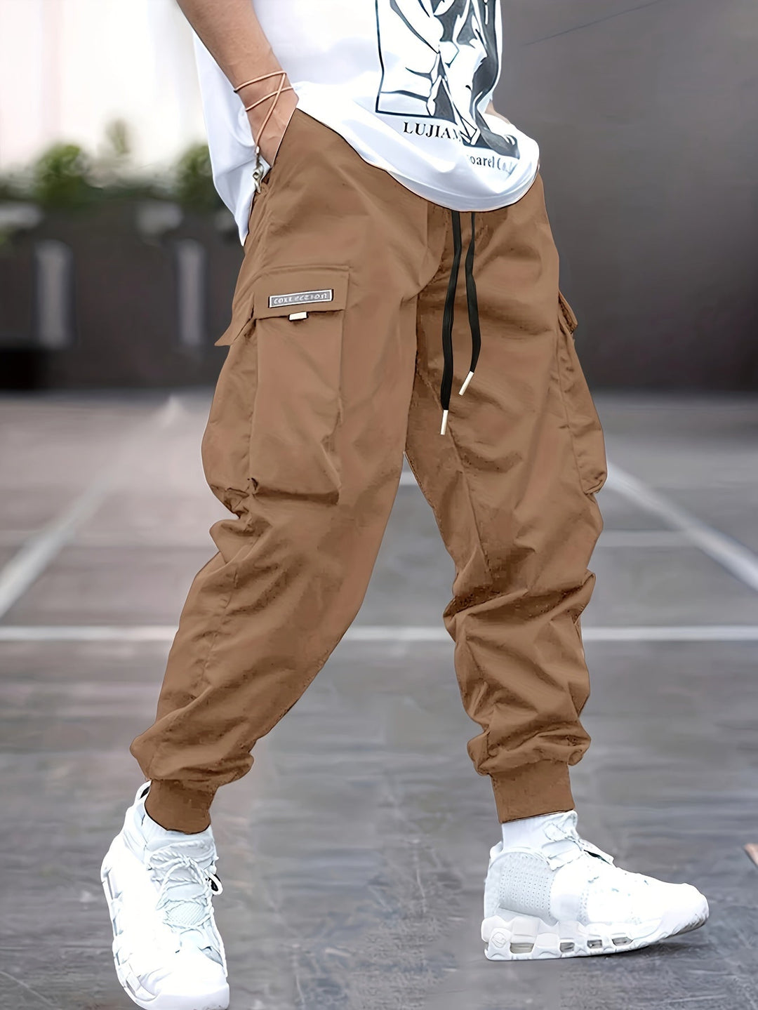 Stylish olive green men's drawstring cargo joggers, merging comfort with a modern streetwear aesthetic.