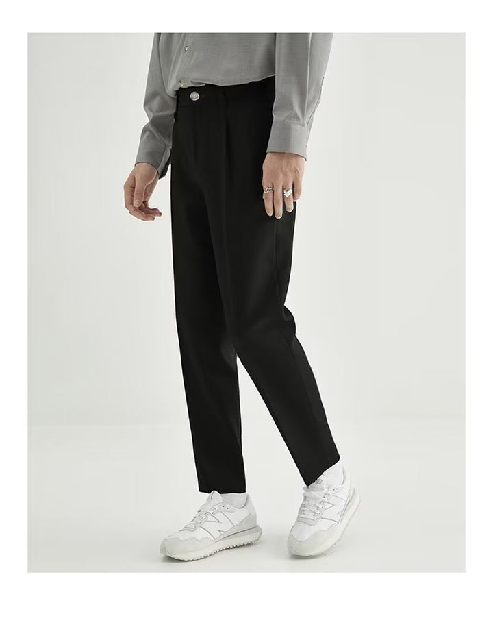Stylish brown men's cropped dress pants, high-waisted with pleats for a versatile, modern fit.