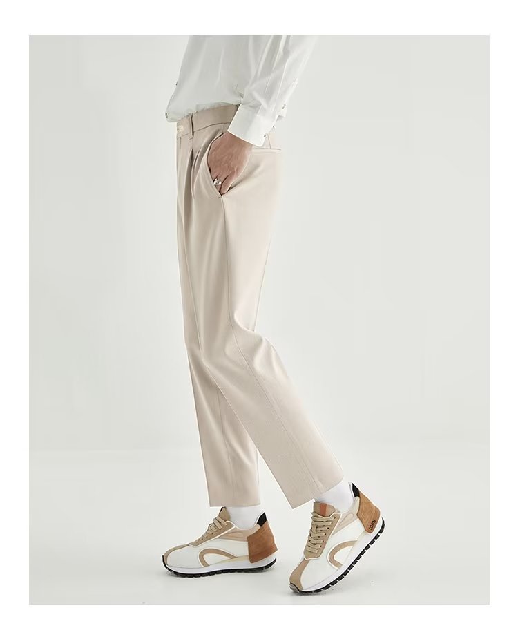 Versatile men's black high-waisted pleated cropped dress pants, a modern choice for any occasion.
