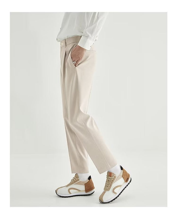 Versatile men's black high-waisted pleated cropped dress pants, a modern choice for any occasion.