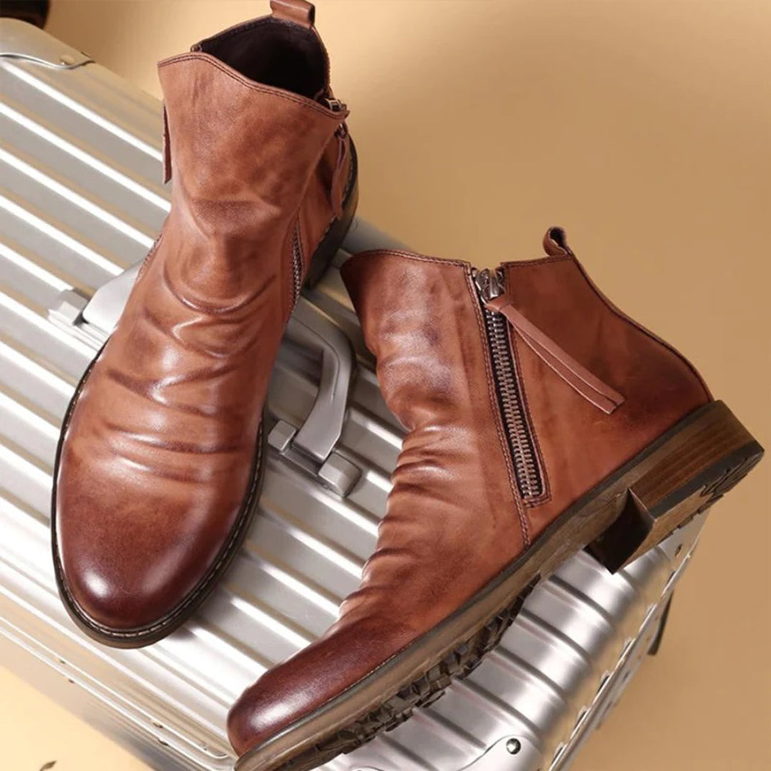 Men's black leather zip boots with convenient side closure, perfect for casual everyday wear.