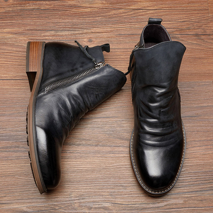 Durable men's leather zip boots in black, designed for comfort and everyday fashion.