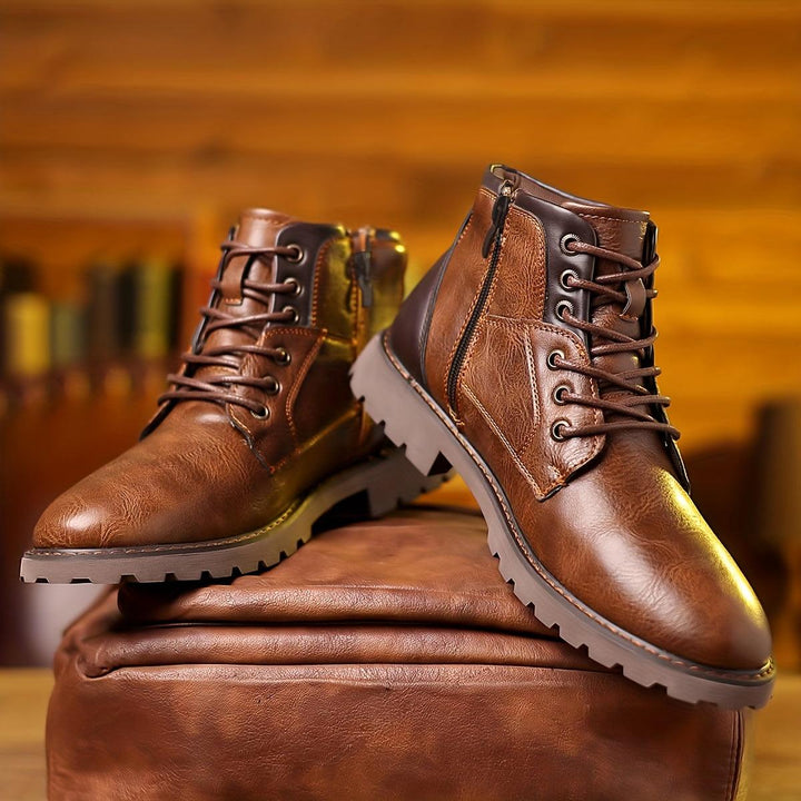 Close-up of new men's luxury leather dress boots with a sleek zipper detail.
