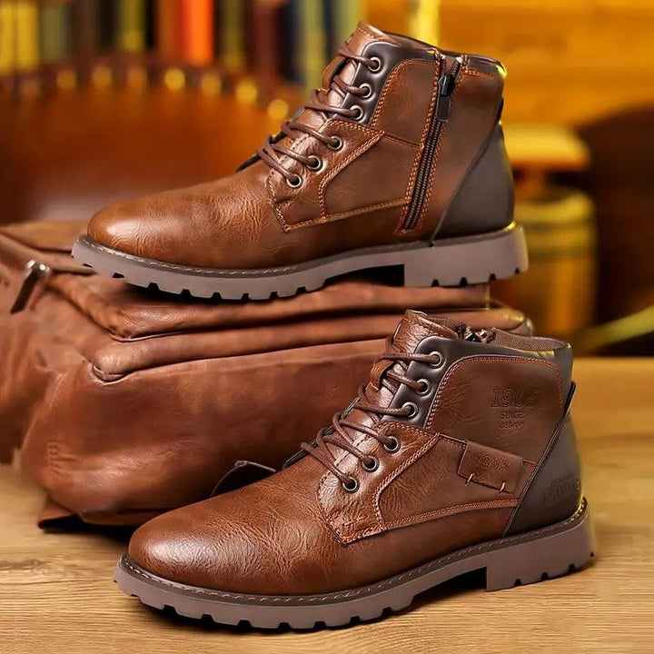 Pair of newly arrived men's leather boots, featuring a sophisticated design with a functional zipper.