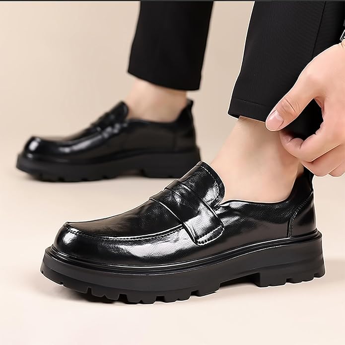 Men's black moc toe penny strap slip-on loafers, elegant & versatile for dress or casual wear.