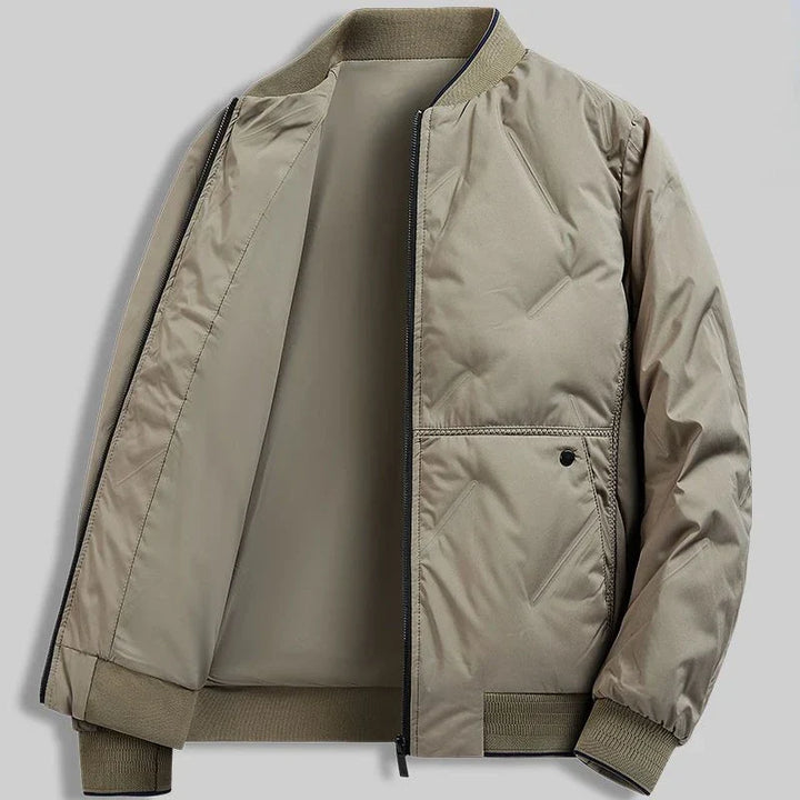 Stylish blue men's quilted bomber jacket. Everyday casual outerwear, ideal for fall/spring fashion.