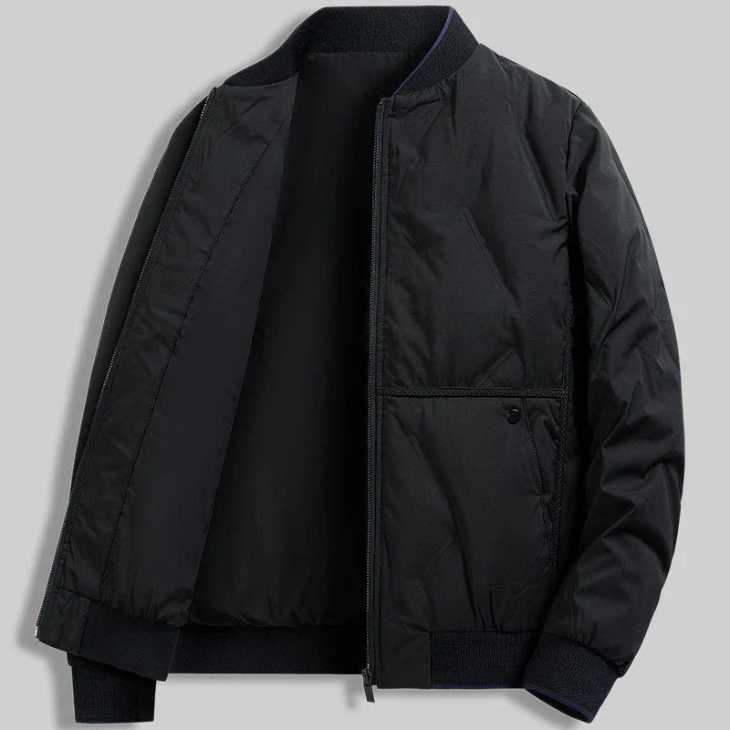 Lightweight men's quilted bomber jacket in blue. Versatile casual zip-front outerwear for fall/spring fashion.