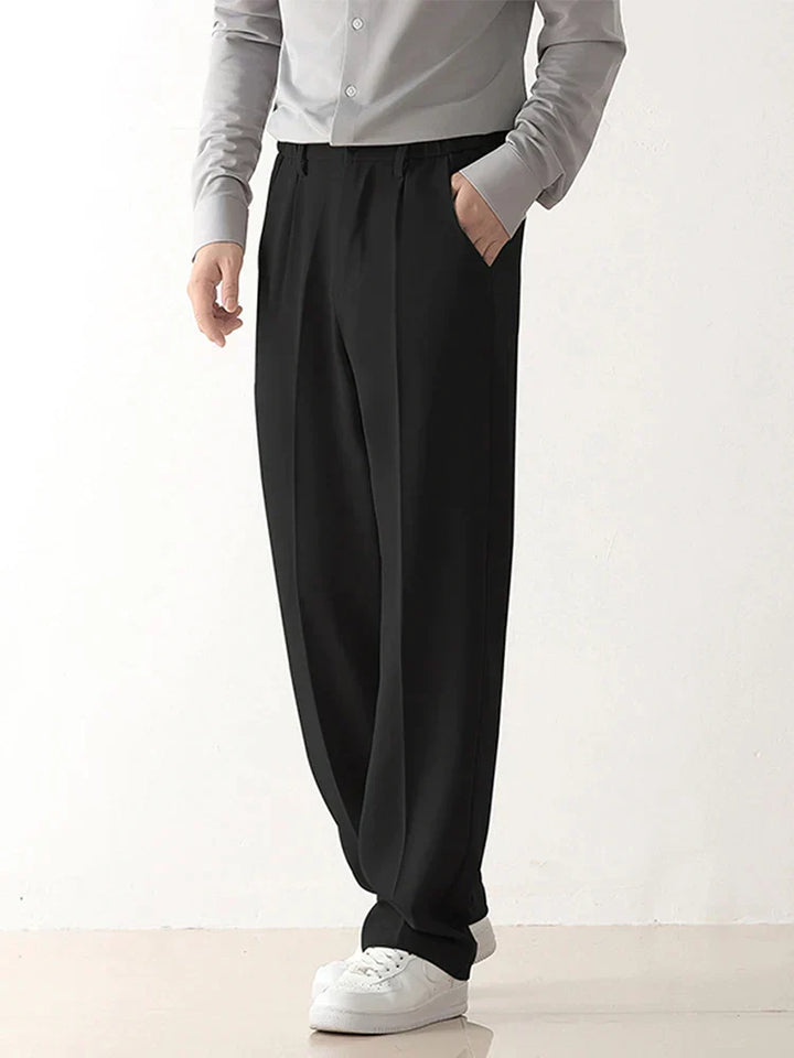 Men's black relaxed fit tailored draped trousers for versatile business and casual wear.