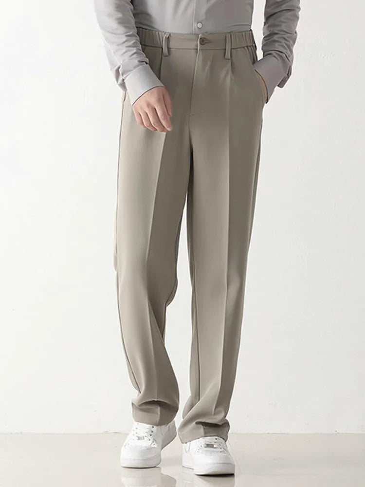 Tailored men's relaxed fit chino trousers in black polyester, perfect for formal or smart casual outfits.