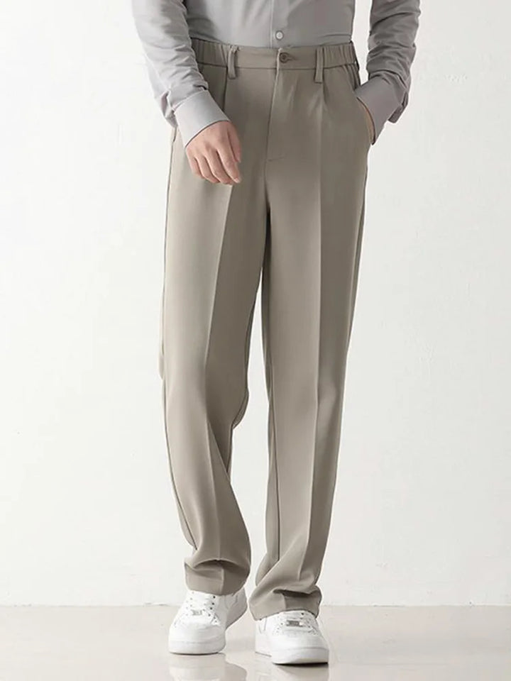 Tailored men's relaxed fit chino trousers in black polyester, perfect for formal or smart casual outfits.