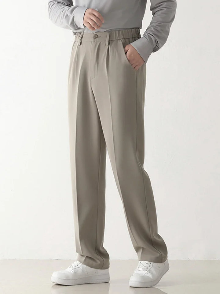 Draped men's trousers in a relaxed fit, ideal for comfortable yet stylish business and casual menswear looks.