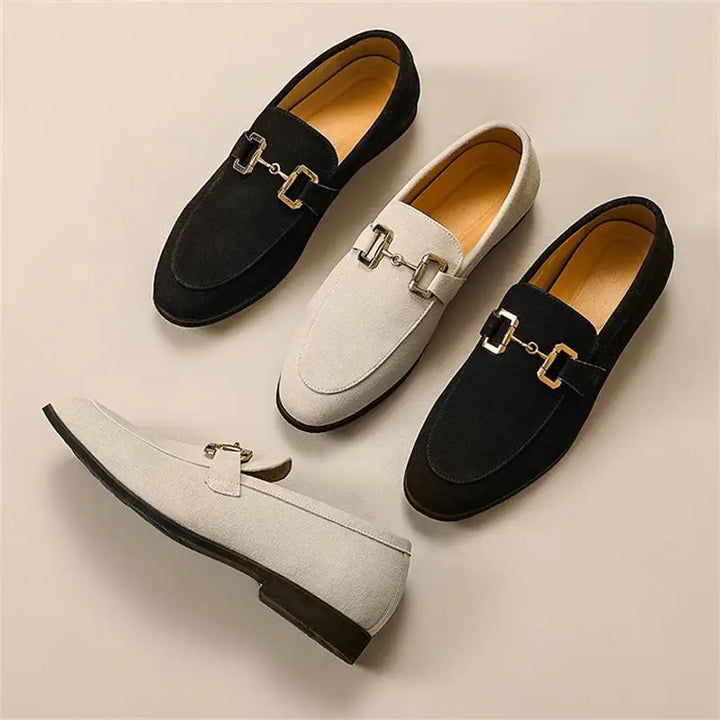Refined men's slip-on loafers with distinguished metal detail, suitable for sophisticated smart casual fashion.
