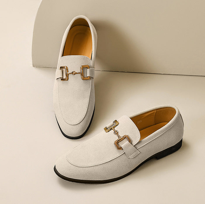 Versatile men's slip-on loafers with metal trim, designed for modern smart casual looks and comfort.