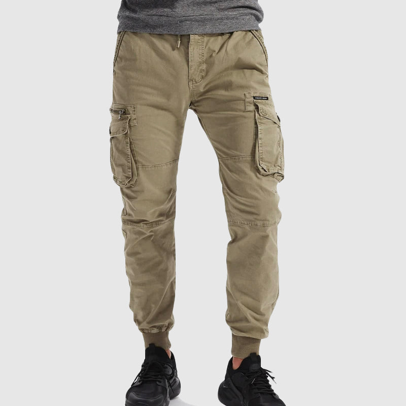 Men's black tactical cargo jogger pants with elastic cuffs, spacious pockets for casual or streetwear.