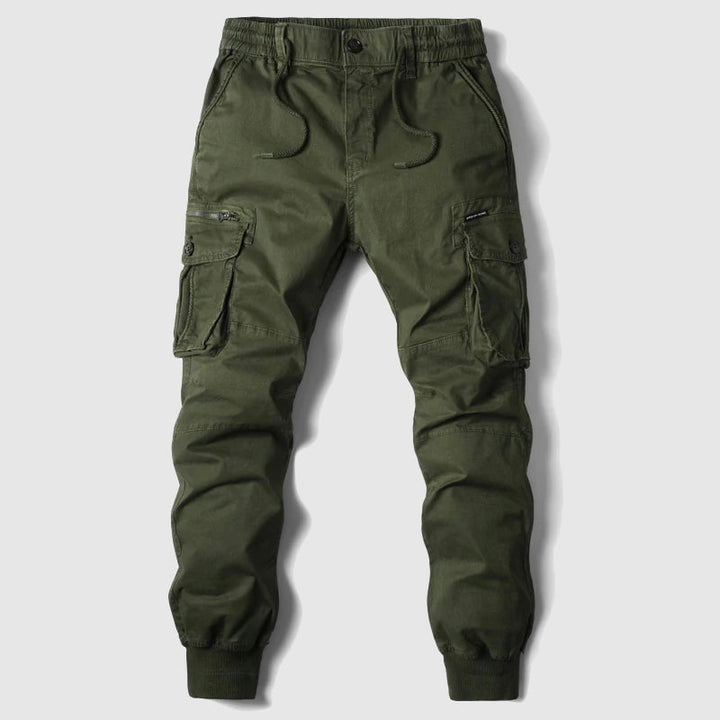Close-up of men's black tactical cargo jogger pants fabric and pocket detail, showcasing quality.