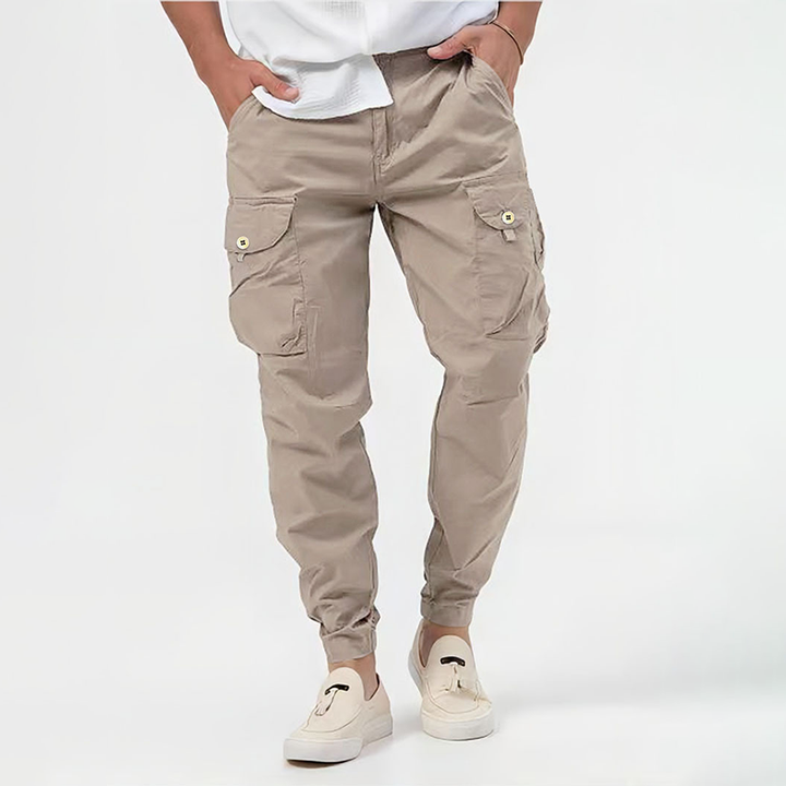 Men's comfortable navy utility pants featuring a drawstring waist and multiple cargo pockets.