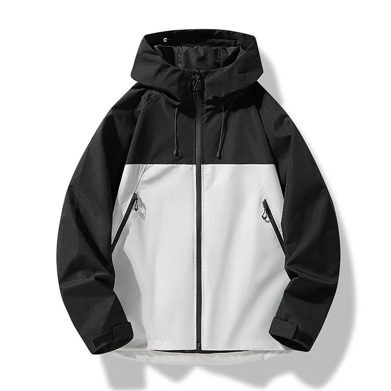 Close-up of the zipper and hood detail on a men's waterproof windproof shell jacket.