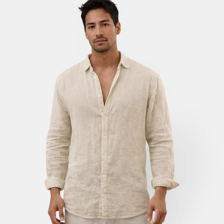 Man wearing a comfortable, breathable men's casual button up shirt for a relaxed summer look.
