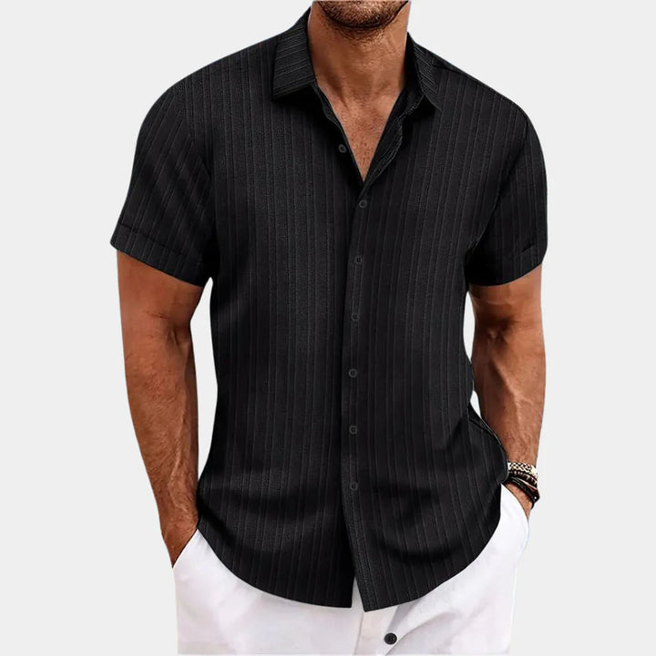 Close-up of the fabric on a men's resilient linen blend button-up shirt, showing its texture.