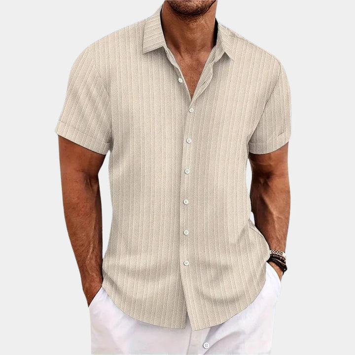 Man wearing a casual men's linen blend button-up shirt, demonstrating its comfortable fit.