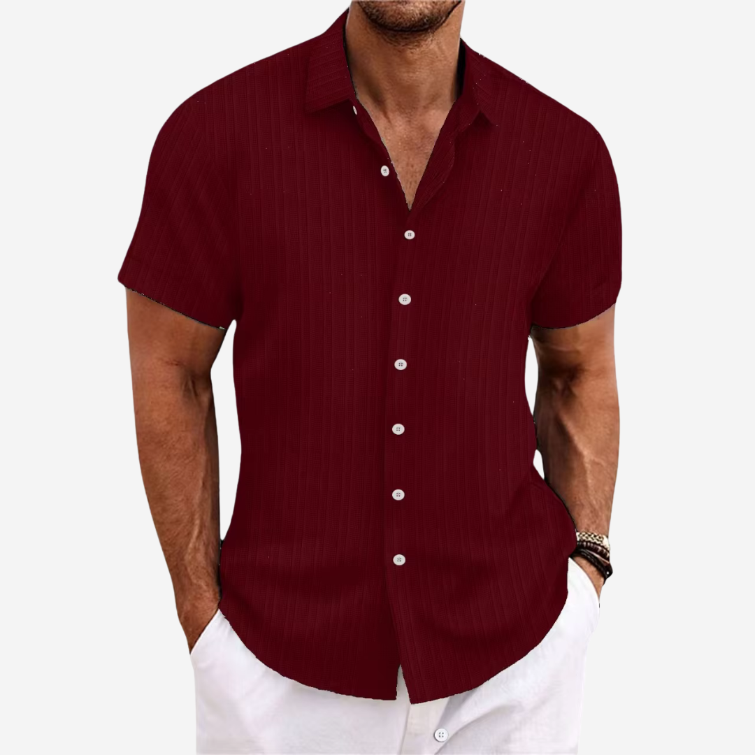 Detail of the collar and buttons on a new men's lightweight linen blend casual shirt.