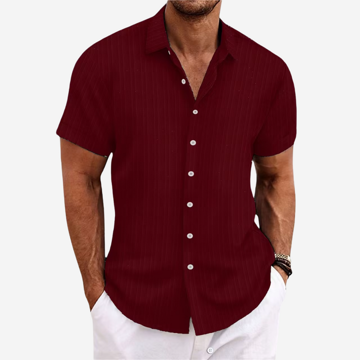 Detail of the collar and buttons on a new men's lightweight linen blend casual shirt.