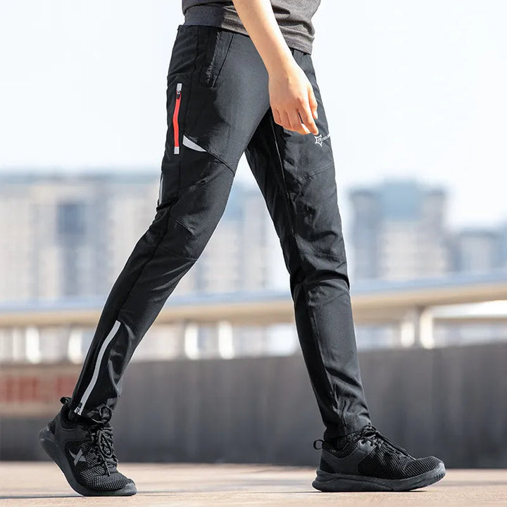 Men's breathable stretch cycling trousers, tapered fit, reflective accents, ideal for performance activewear.