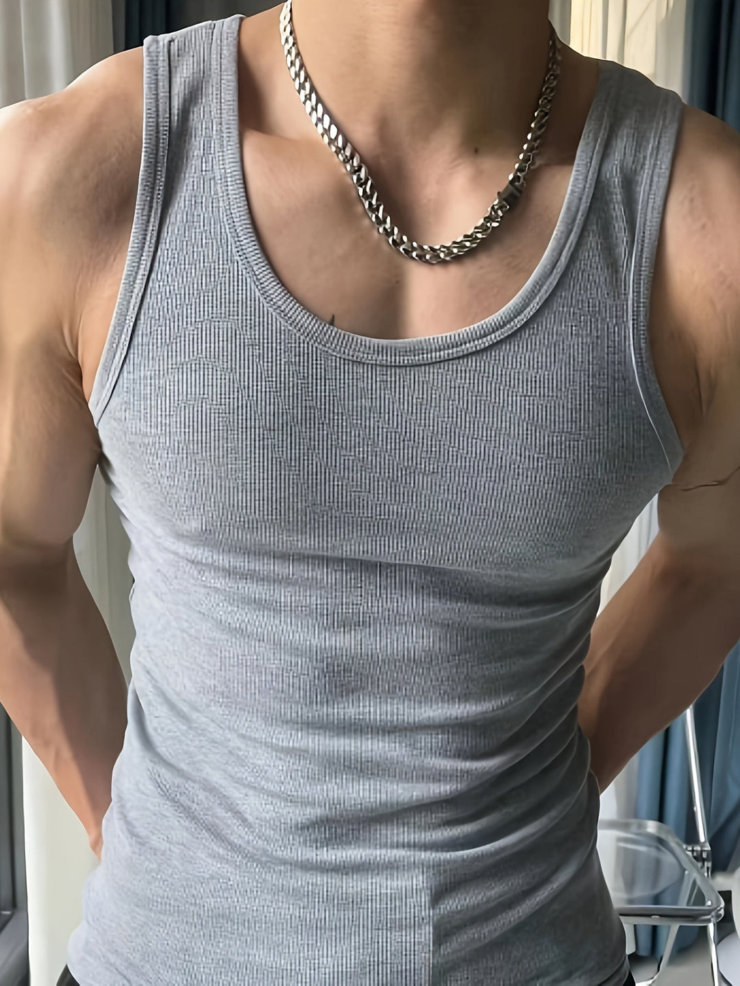 Sleeveless men's gym tank, ideal for workouts, running, & active summer days.