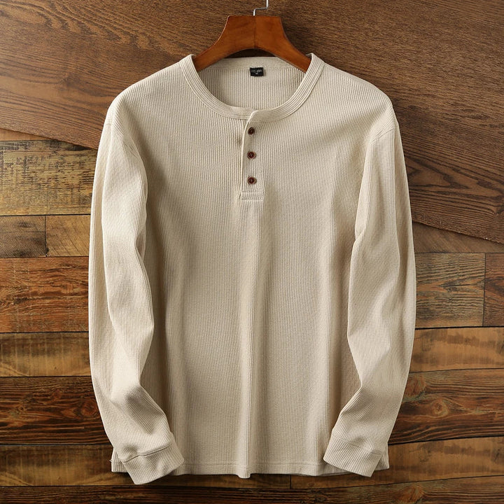 Men's modern waffle knit Henley, a smart & comfortable foundation for modern men's outfits.