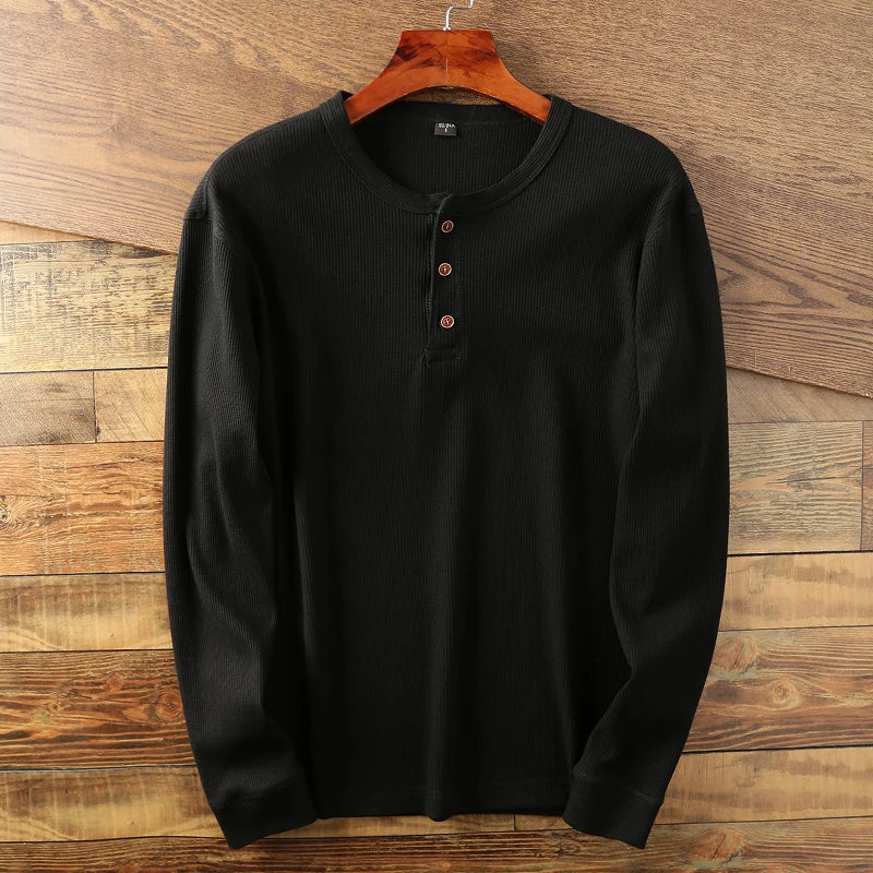 Breathable long sleeve men's waffle Henley, perfect for versatile year-round comfortable wear.