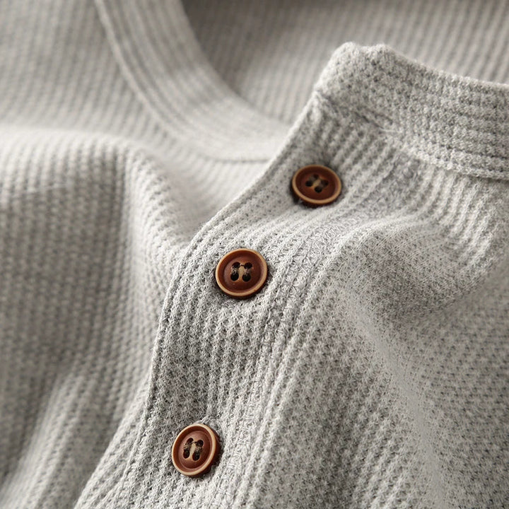 Breathable men's waffle knit Henley, offering comfortable, smart style for all-day wear.