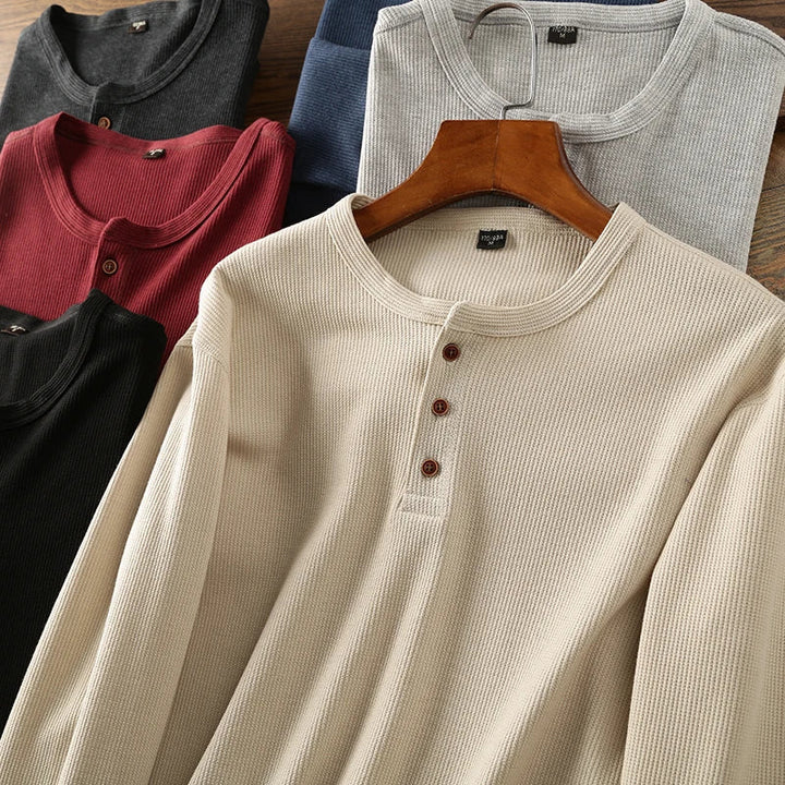 Close-up of men's waffle texture Henley shirt, showcasing its unique comfortable knit detail.