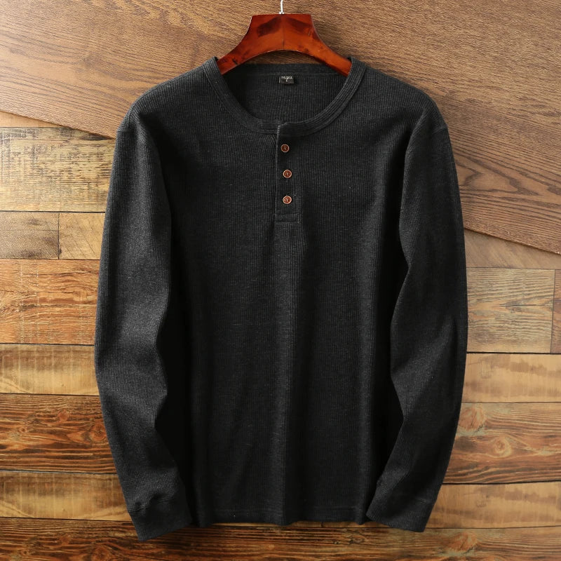 Smart casual men's long sleeve Henley with breathable waffle knit, modern and versatile.