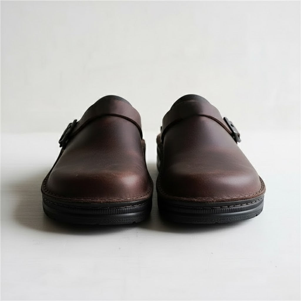 Close-up of the genuine leather texture on men's orthopedic slip-on clogs, emphasizing quality and comfort.