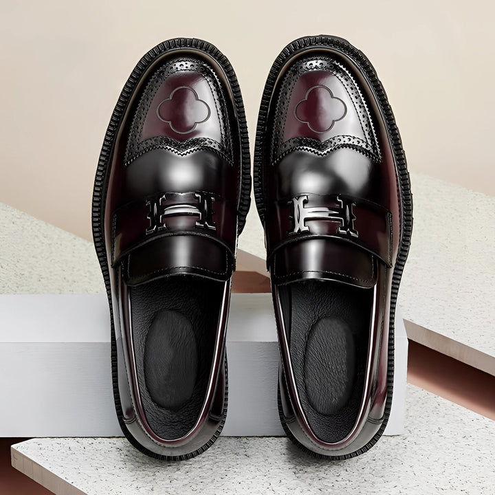 Stylish men's burgundy leather slip-on loafers featuring a trendy chunky sole, perfect for dress shoes or business casual.