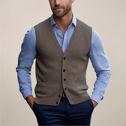 Men's buttoned knit sweater vest in a soft spring green hue, perfect for layering and smart casual outfits.