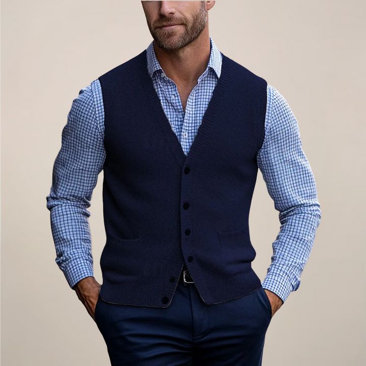 Stylish men's sweater vest with buttons, a key knitwear item for spring, offering a sophisticated look.